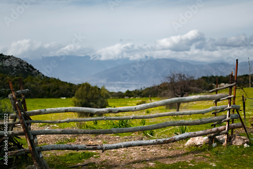 A split rail fence along a countryside field.  © Tolga Erdem