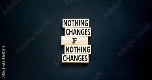 Nothing change symbol. Concept words Nothing changes if nothing changes on wooden blocks. Beautiful black table black background. Business nothing changes concept. Copy space.