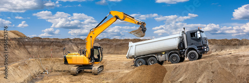  excavator is digging and loading at construction site