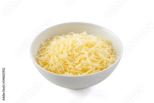 Grated parmesan cheese in white bowl on white background..