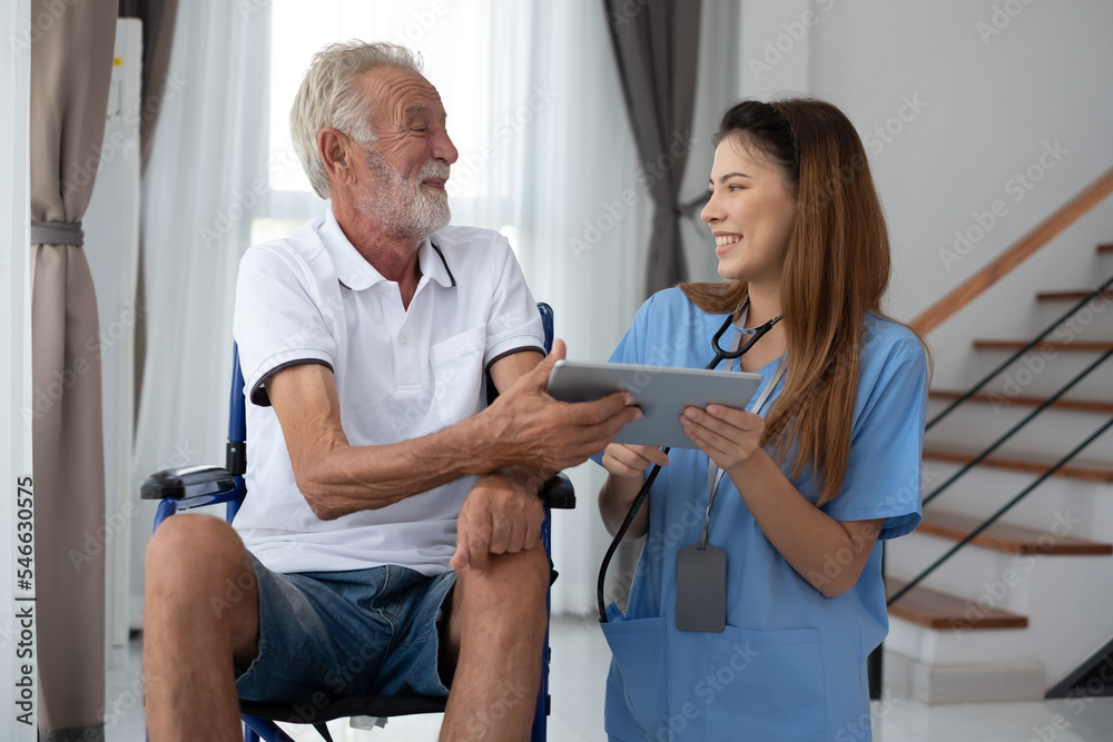 Fototapeta premium Caring nurse with senior man sitting in the bedroom . caucasian man. Discussing. Caring caregiver and senior citizen. Nurse helping senior patient . Young nurse helping elderly man