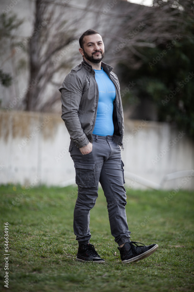 Obraz premium Natural looking guy posing outdoors, wearing casual clothes