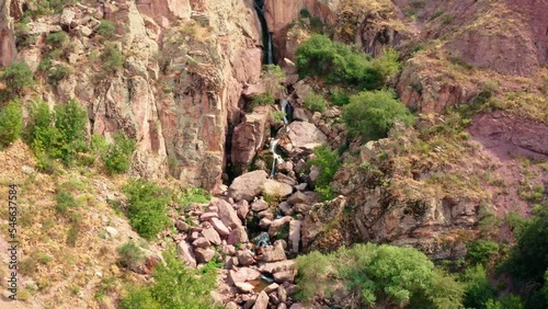 Canyon Akkum in the South Kazakhstan region. An ancient canyon with a waterfall in the Kazygurt region. Sacred waterfall in muslim place for kazakhs in akkum valley photo