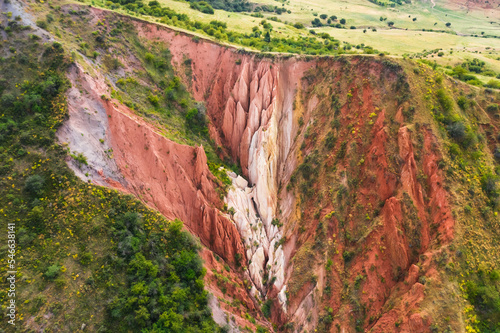 Canyon Akkum in the South Kazakhstan region. An ancient canyon with red clay in the Kazygurt region. Sacred Muslim place for Kazakhs Akkum valley photo