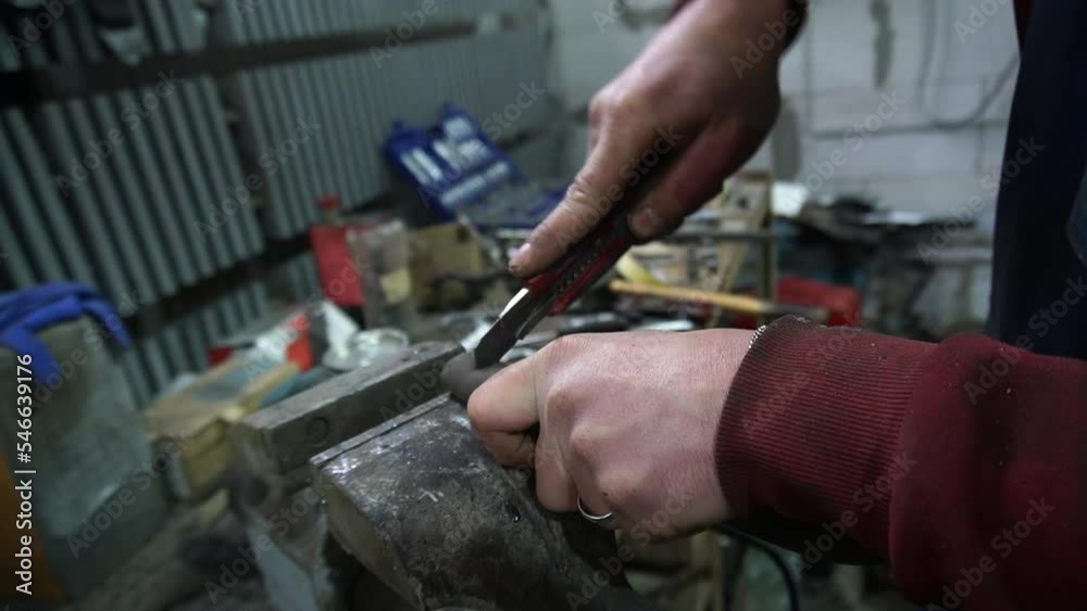 a mechanic disassembles an old dirty car engine on a red lift for repair and tuning a mechanic disassembles an old dirty car engine on a red lift for repair and tuning