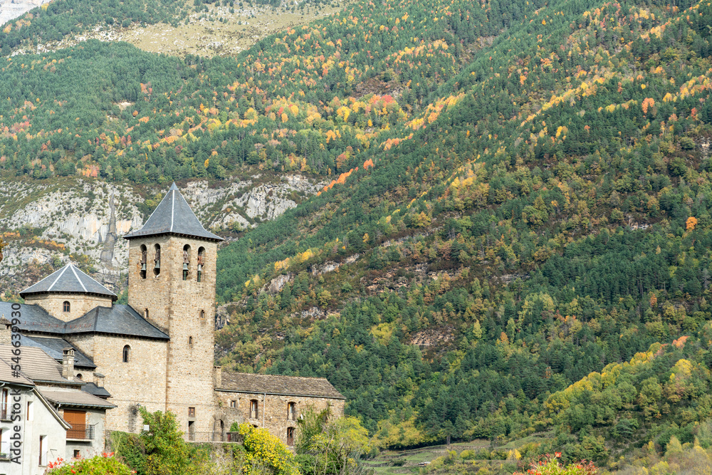 Torla village and church and Spectacular view of the Ordesa Valley with the colors of autumn. Ordesa and Monte Perdido National Park in Huesca, Aragon, Spain
