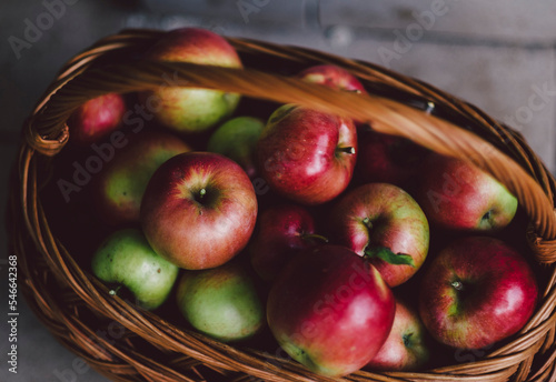 Close-up of fresh healthy apples in wicker basket