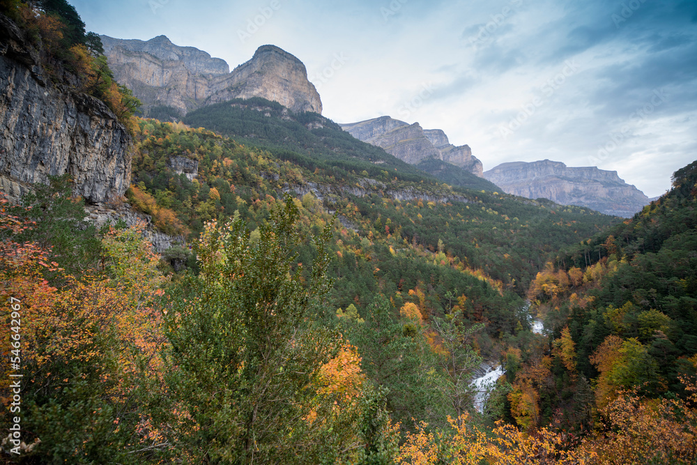 Spectacular view of the Ordesa Valley with the colors of autumn. Ordesa and Monte Perdido National Park in Huesca, Aragon, Spain Spectacular view of the Ordesa Valley with the colors of autumn. Ordesa and Monte Perdido National Park in Huesca, Aragon, Spain