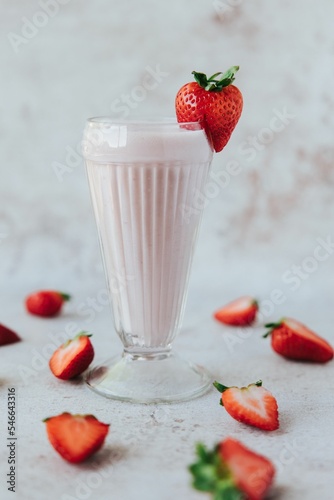 Vertical shot of refreshing strawberry milkshake