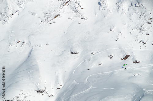 Speedflyer riding on steep ski slope in breathtaking winter mountain landscape at ski resort Mölltaler Gletscher photographed. Mölltaler glacier, Flattach, Kärnten, Austria, Europe.