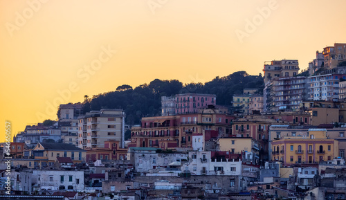Fototapeta Naklejka Na Ścianę i Meble -  Residential Apartment Home Buildings in Historic Downtown City on Mediterranean Coast of Naples, Italy. Sunset Sky.