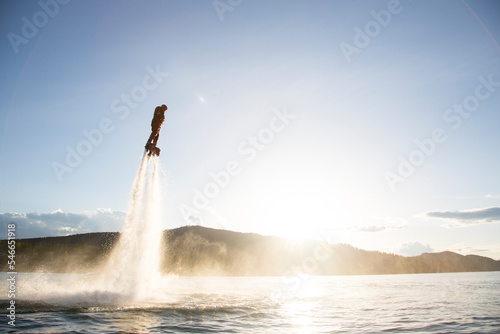 A man flyboards on Whitefish Lake in Whitefish, Montana. photo