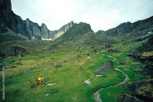 Climbers gather around a helicopter in Fairy Meadows in the Cirque of the Unclimbables in the Northwest Territories, Canada. photo