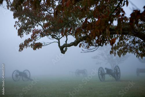 Civil War era battle field at dusk, in the fog.