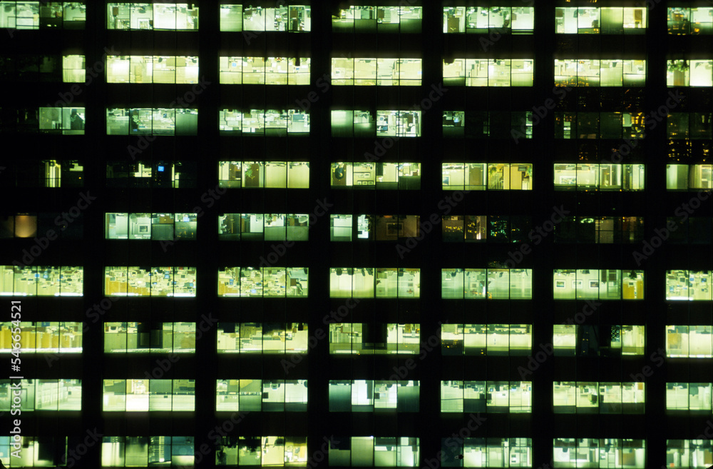 Facade of an office building at night, New York City, New York. Facade of an office building at night, New York City, New York.