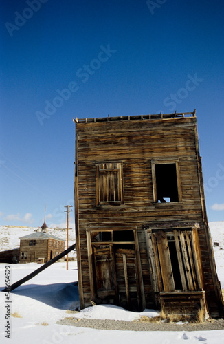 An old Hotel leaning to one side, gosht town of Bodie, California. photo