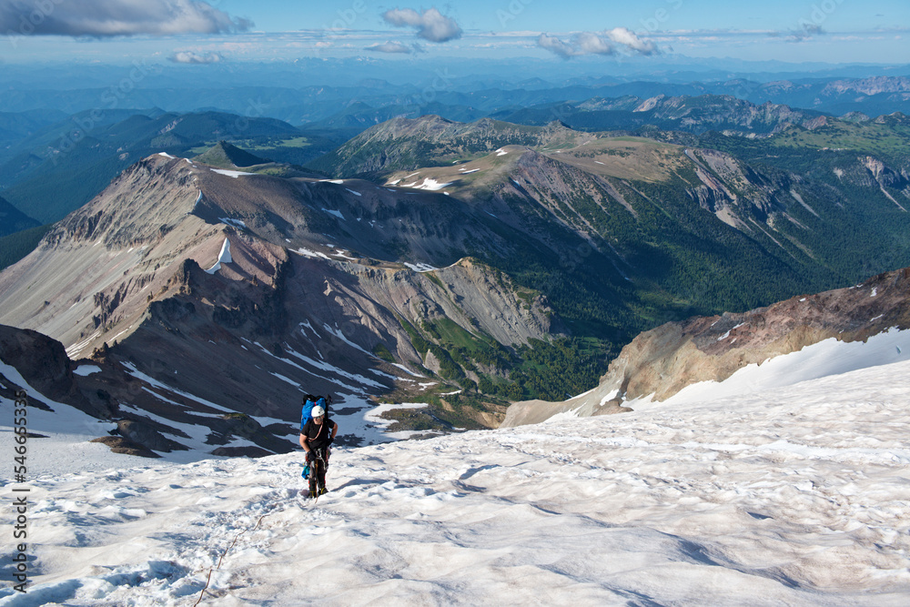 Mountain climber making way up Inter Glacier of Mount Rainier towards
