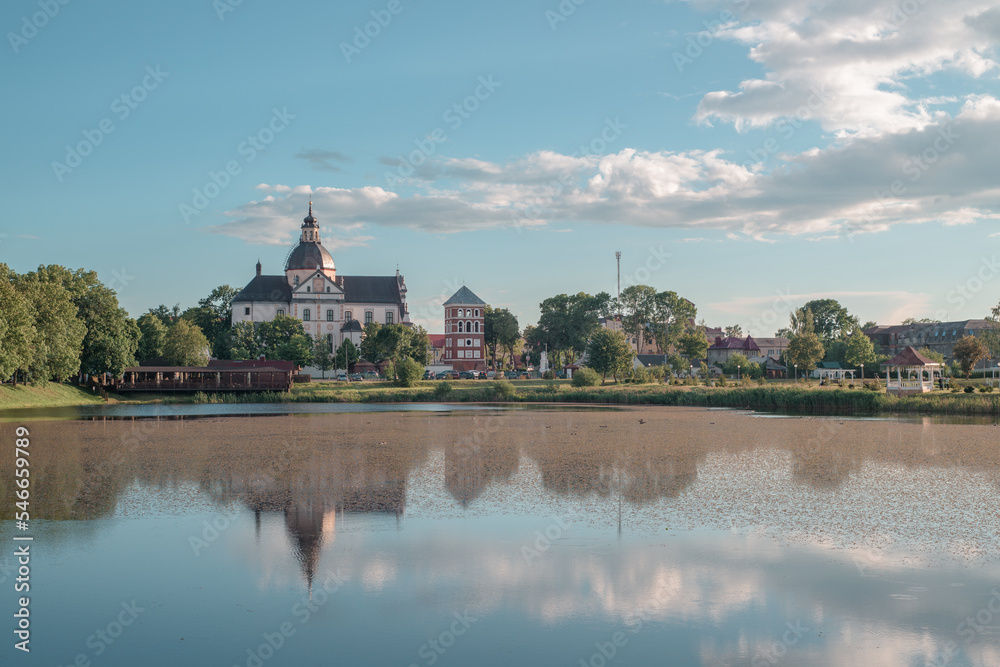 Evening view of the ancient church in Nesvizh on the shore of the lake.