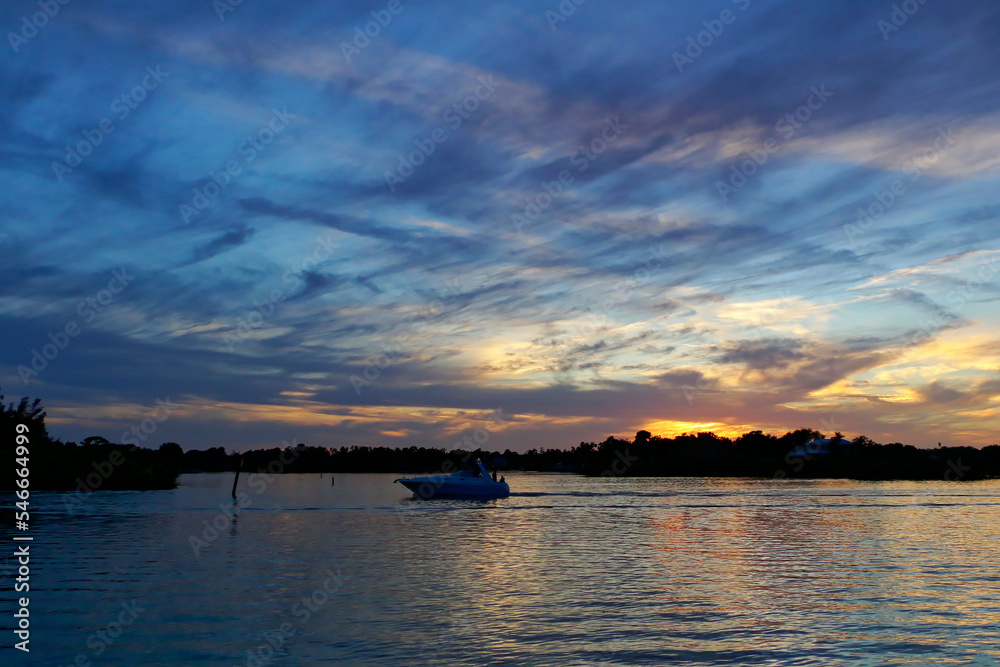 Naklejka premium Boats silhouetted against the sunset, Tarpon Springs, Florida, Anclote River