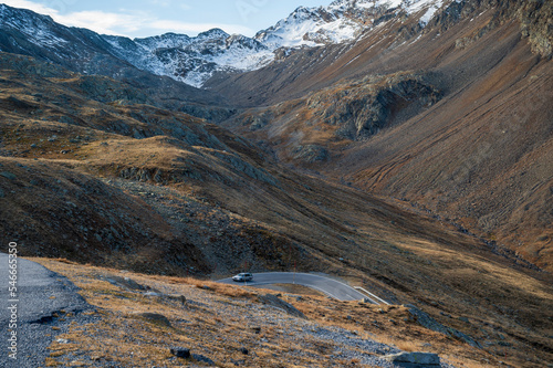 Mountain asphalt road high in rocky mountains.