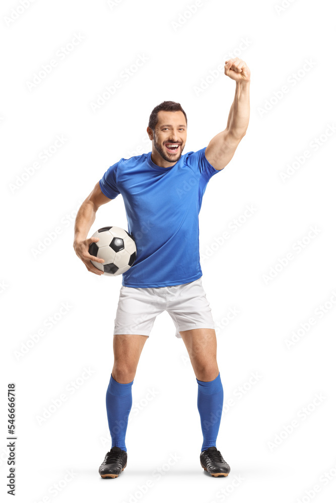 Excited fotball player holding a ball and cheering Excited fotball player holding a ball and cheering