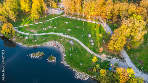 Aerial view of the Augarten city park in autumn mood with the river Mur streaming through the city of Graz