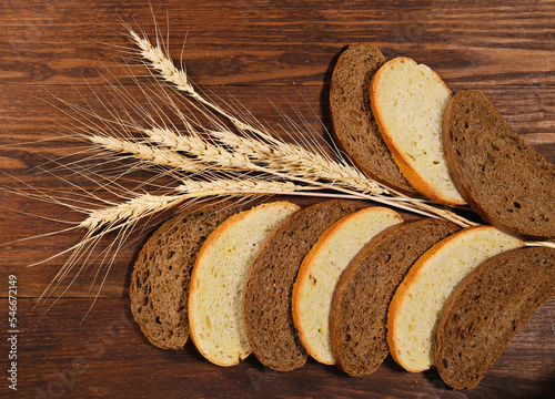 Still life with bread and wheat ears