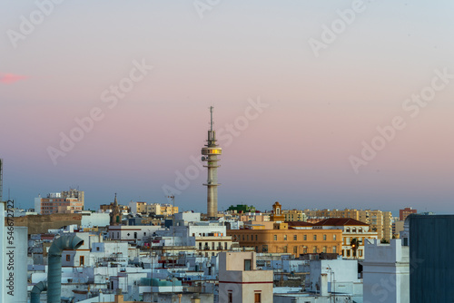 Colorful sunset over the historic center of the ancient city of Cádiz in Andalusia Spain © henryopzolder