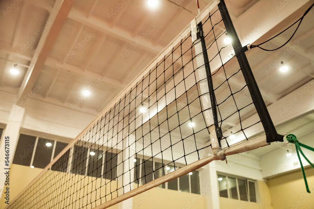 Foto de Net of volleyball court in old school gym, bottom view