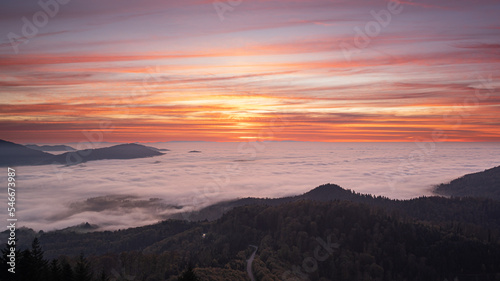 Sunset over the mist-covered entrance to the Murg Valley in the German Black Forest