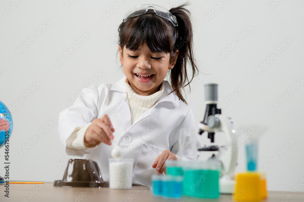 education, science, chemistry and children concept - kids or students with test tube making experiment at school laboratory education, science, chemistry and children concept - kids or students with test tube making experiment at school laboratory