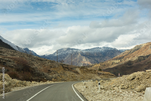 Panoramic view of the road among the mountains of Dagestan, Russia. Autumn landscape and highway. Mountain road among the rocks
