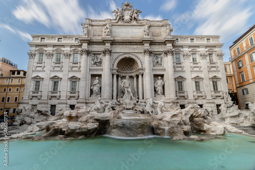 Trevi Fountain (Fontana di Trevi) during a sunny day, long exposure photo of the famous fountain in the Trevi district of Rome - Italy