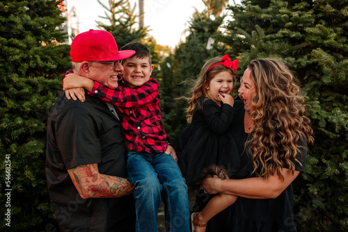 Adorable Family at Christmas Tree Lot photo