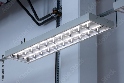 Bilde på lerret Close-up of an industrial fluorescent lamp, lamps hanging from the ceiling in a