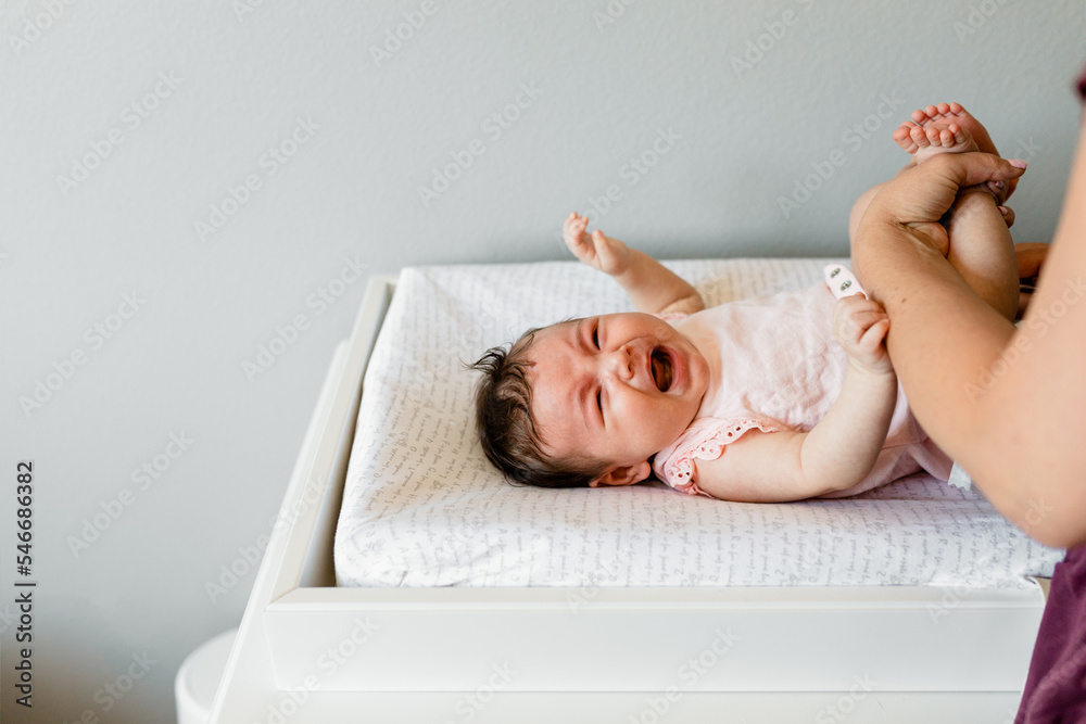 Newborn Baby Cries During A Diaper Change Stock Photo Adobe Stock