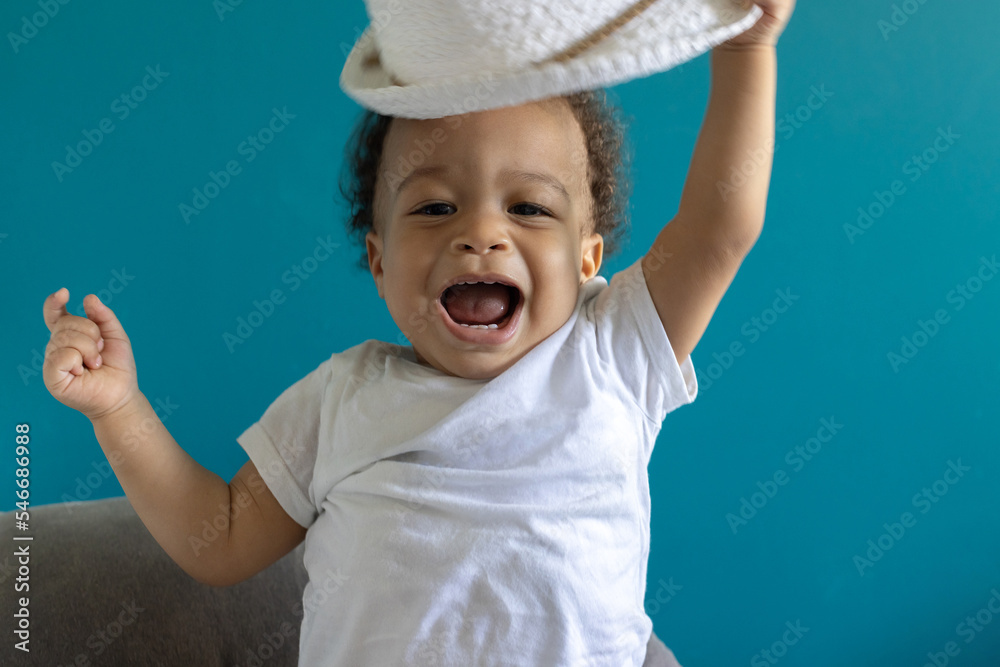 joy, excited happy smiling one year old baby boy portrait in hat joy, excited happy smiling one year old baby boy portrait in hat
