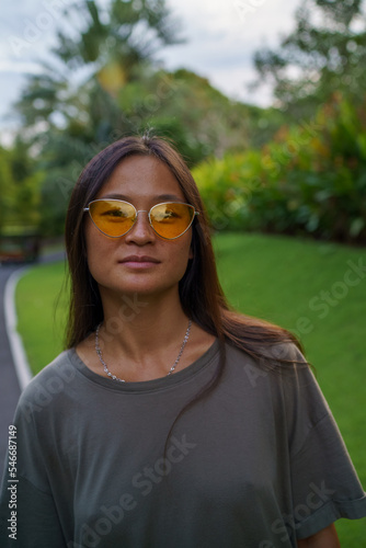 Portrait of Chinese woman with orange sunglases photo