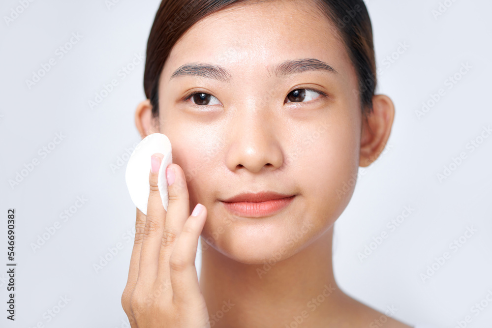 Beautiful young woman with white pads and clean skin. Beautiful young woman with white pads and clean skin.