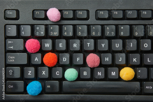 Colorful balls in place of keys in keyboard. photo