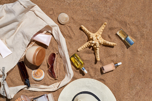 Composition of seashells and starfish, bag and cosmetic products photo