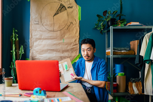 Asian Man Having Online Video Meeting 