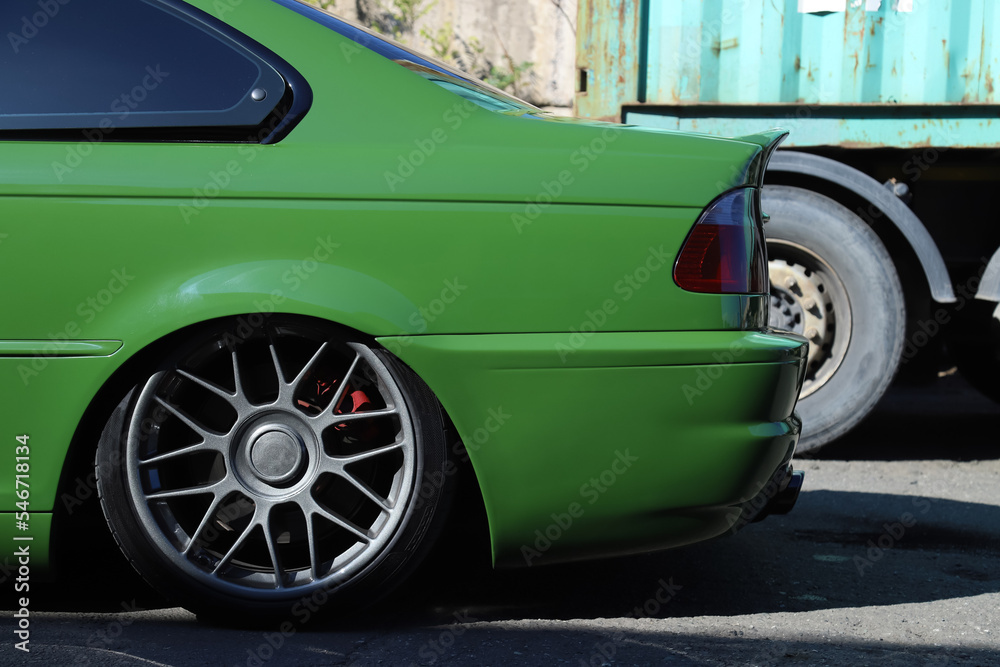 Left side of the car with low suspension. Shallow depth of field