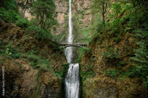 Beautiful shot of the Benson Bridge over Multnomah Falls during the day photo