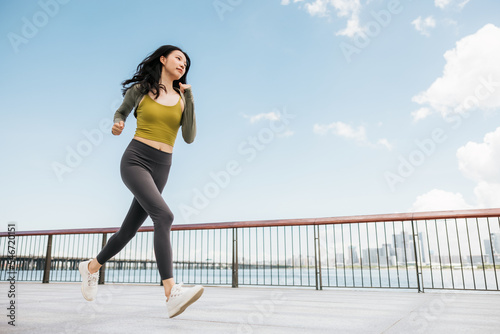 Sportswoman running in the city