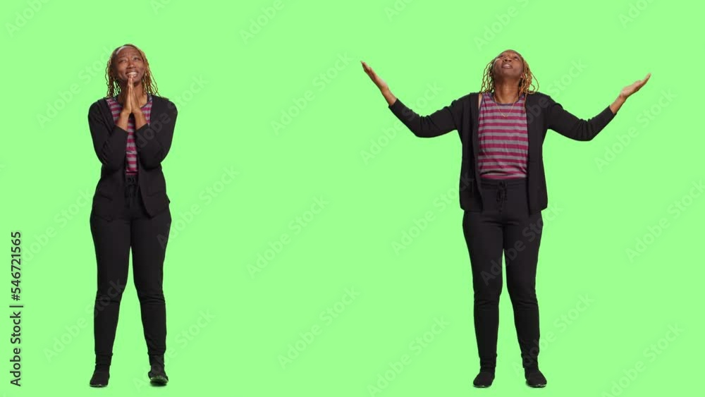 Hopeful spiritual girl praying to god for miracle, asking to fulfill wish and believe in religion. Full body standing over greenscreen backdrop, showing prayer hands and wishing for luck.