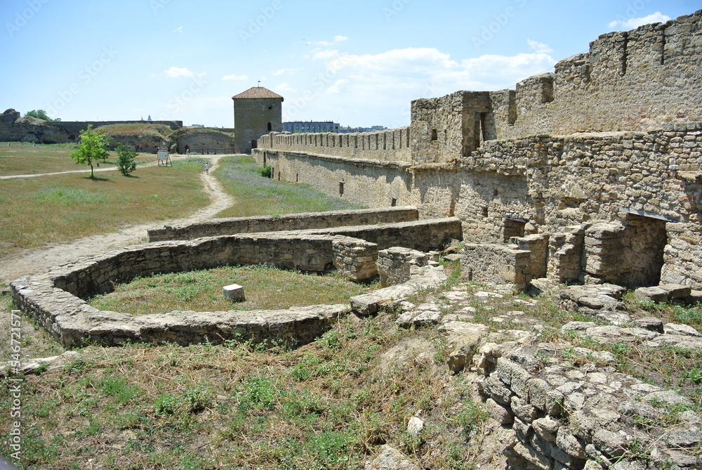 Ruins of the medieval castle wall and buildings in Europe in good weather 