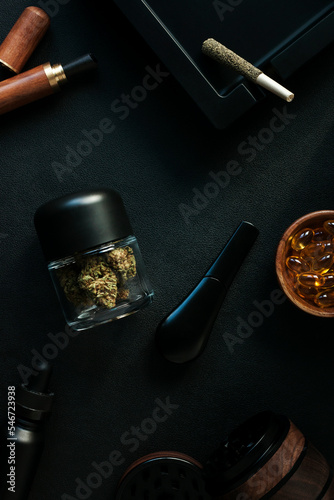 Flatlay of assorted luxury cannabis accessories and products photo