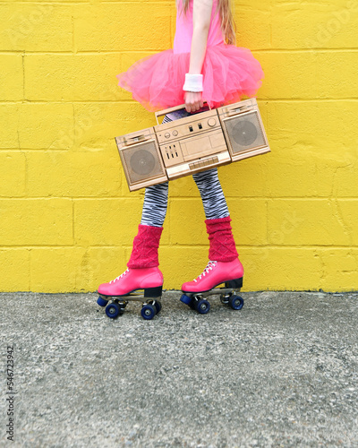 Girl Holding Music Boombox and Skates