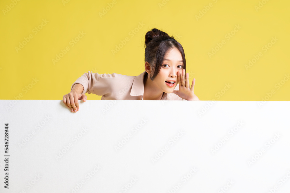 image of asian girl standing and posing with billboard image of asian girl standing and posing with billboard